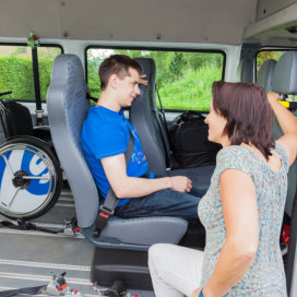 woman talk to man inside the van