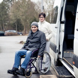 woman and man in wheelchair smiling