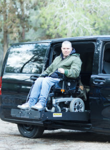 man in wheelchair smiling